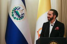 El Salvador's President Nayib Bukele speaks during a decoration ceremony to the Apostolic Nuncio to El Salvador Santo Gandemi, in San Salvador, El Salvador.