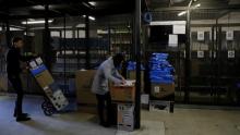 Employees prepare merchandise sold via eCommerce to be delivered to customers at retail chain Magazine Luiza S.A. store in Sao Paulo.